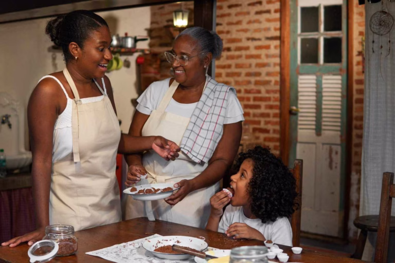 medium-shot-brazilian-family-cooking-tasty-desserts (1)